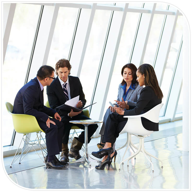 Small business group discussion A meeting with business people viewing and discussing reports